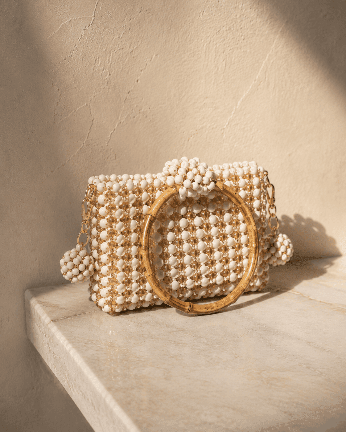 Handwoven seed bead bag on marble surface — BBLux atelier